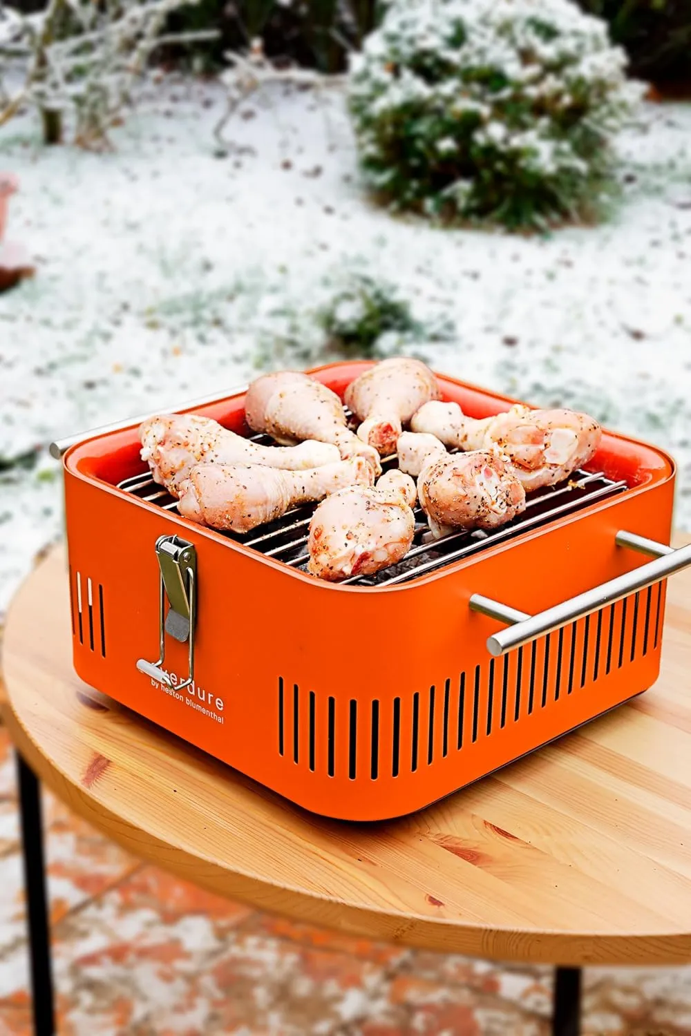 Everdure Cube Portable Charcoal Grill, Tabletop BBQ, Perfect Tailgate, Beach, Patio, or Camping Grill, Lightweight & Compact Small Grill with Preparation Board & Food Storage Tray, Orange